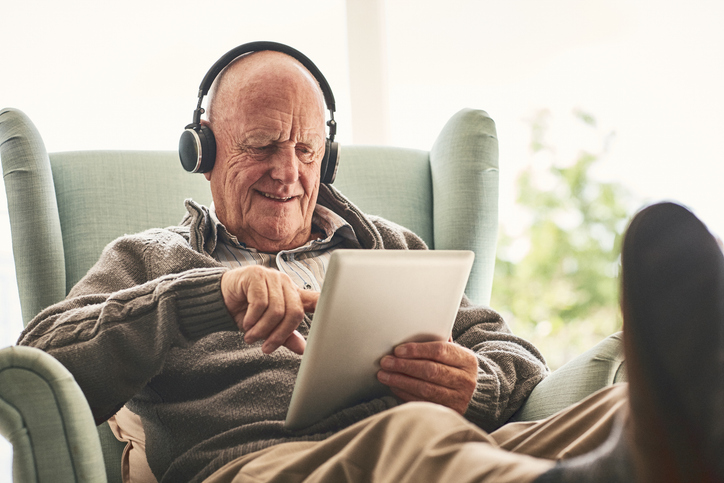 senior male listening to music