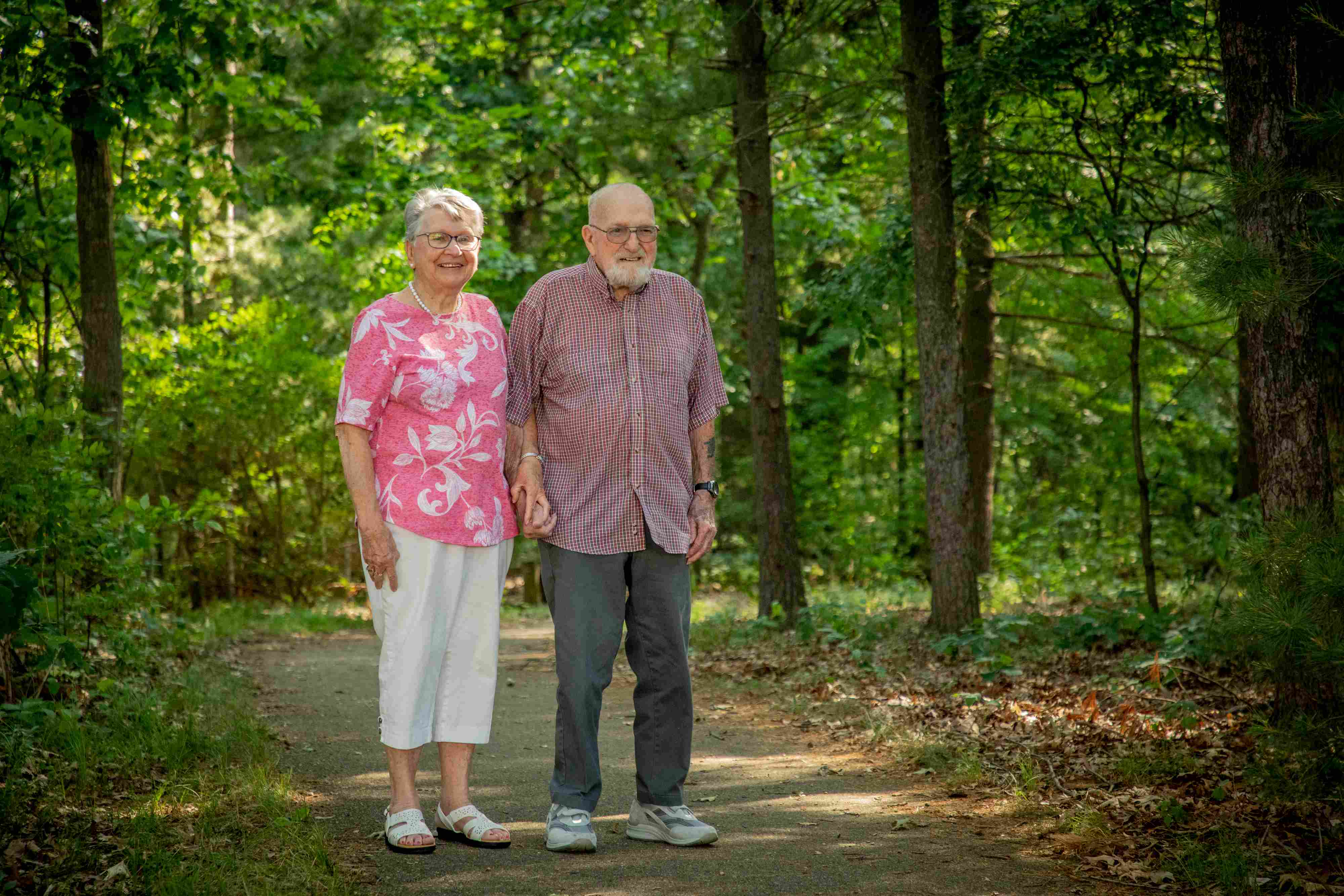senior couple walking on path