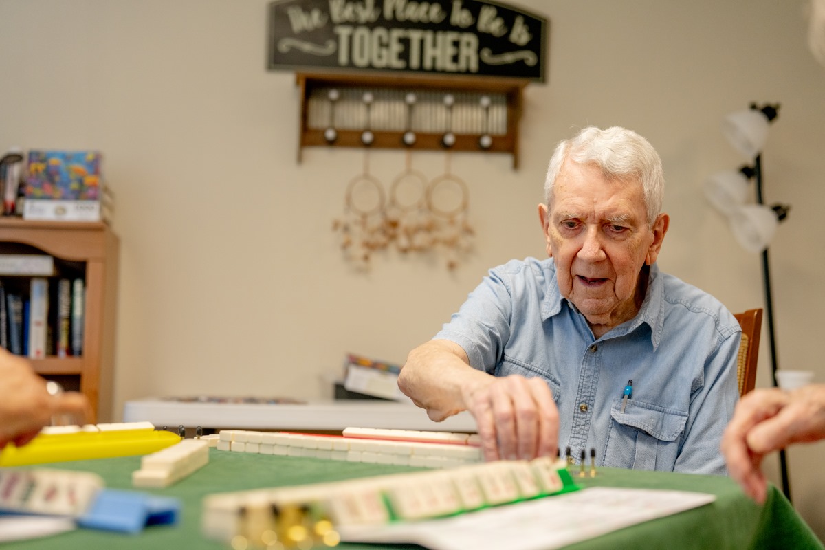 male playing game with group