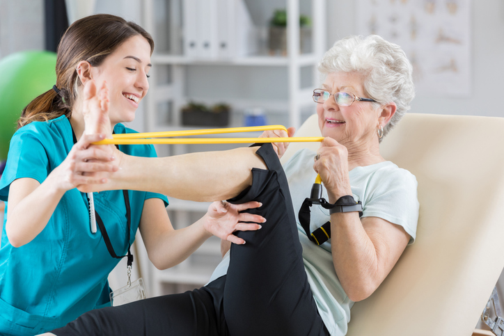 caregiver helping a woman