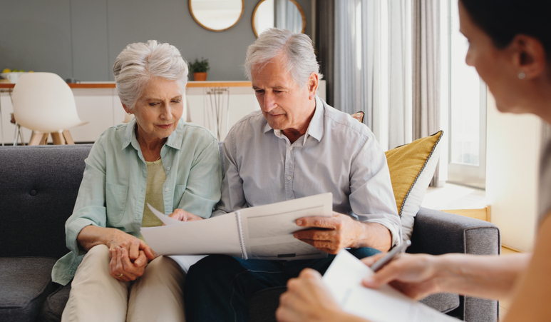 couple reviewing information with caregiver