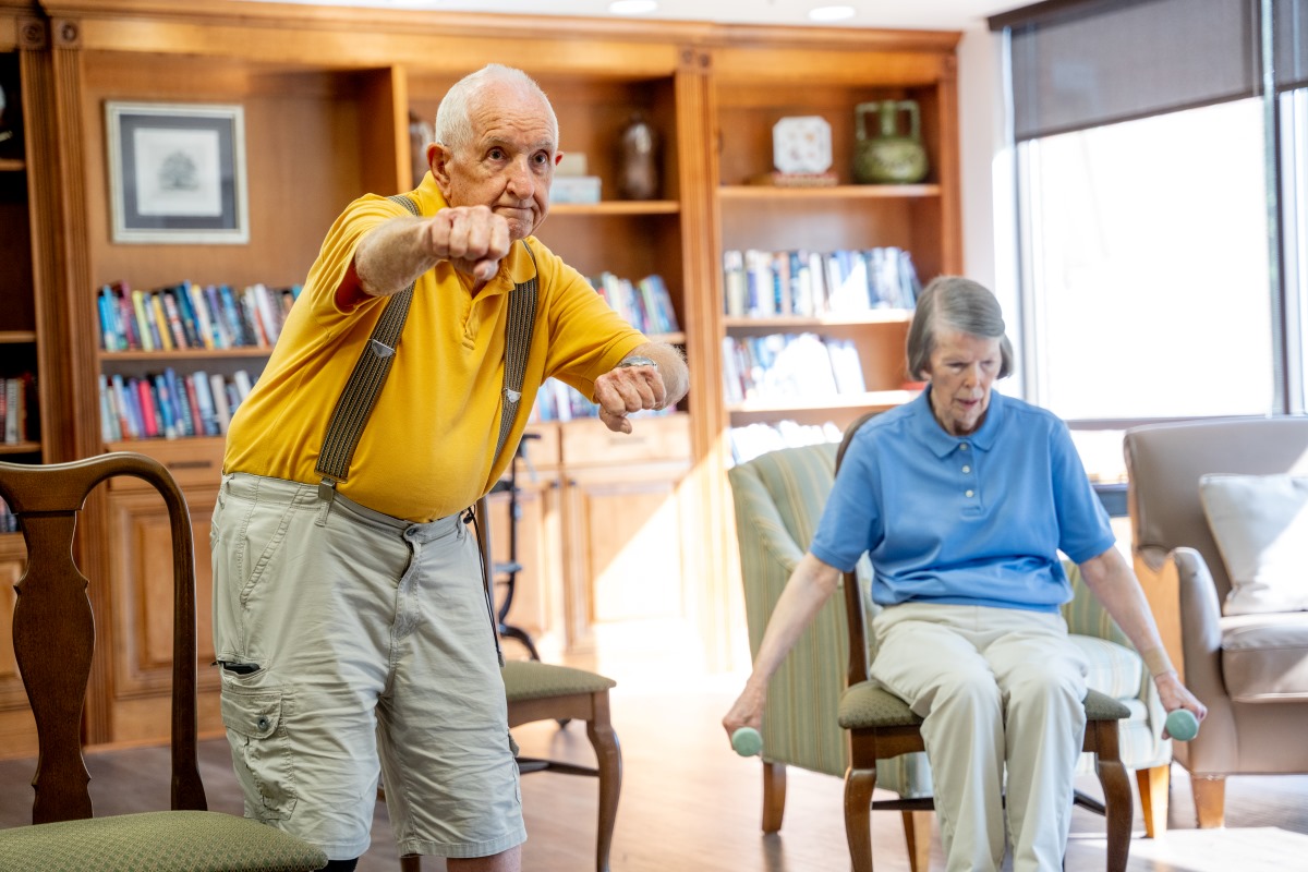 male and female participating in fitness class