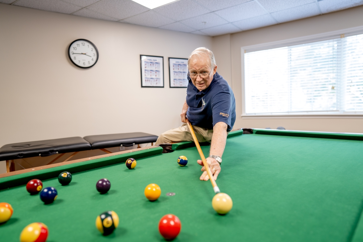male playing pool